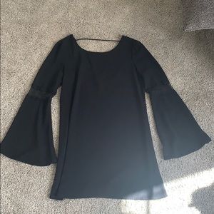 Black dress with lace peep and bellbottom sleeves